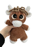 Hand crocheted Highland Cow Plushies in a variety of colors
