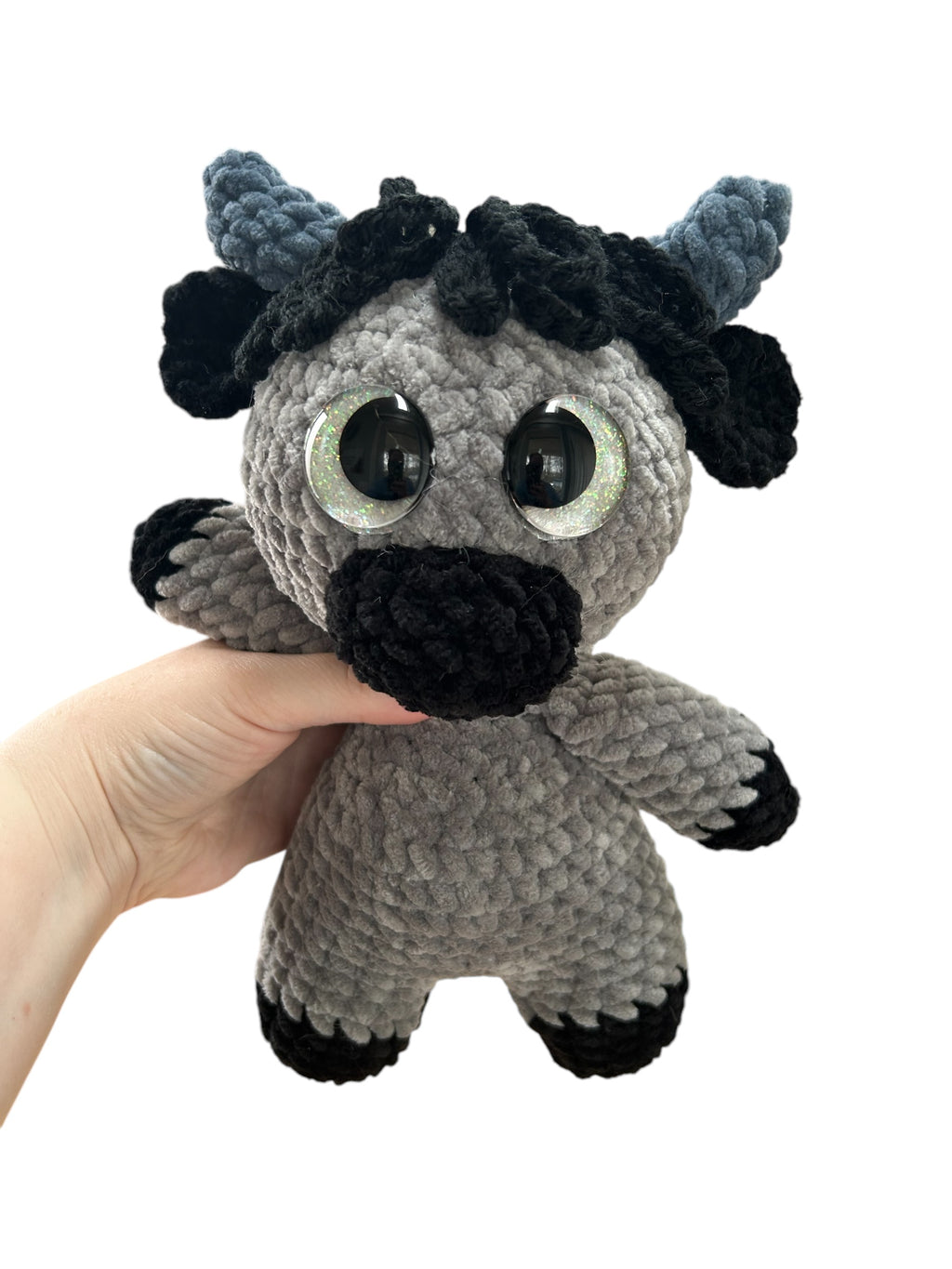 Hand crocheted Highland Cow Plushies in a variety of colors